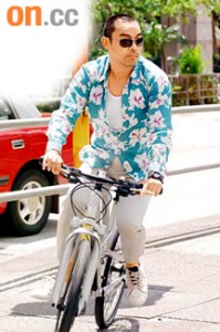 Lau Ching Wan rides his bicycle in "Life Without Principle"